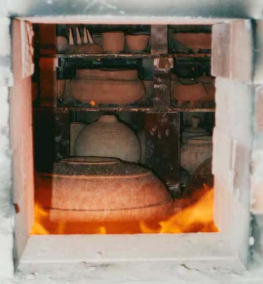 potters hands in clay